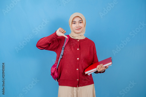 Canvas Print A young woman wearing a red sweater and a white skirt is holding a red book and a red backpack