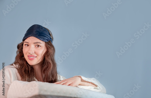 Smiling girl with a sleep mask on, promoting good posture in schoolchildren for a healthier lifestyle. photo