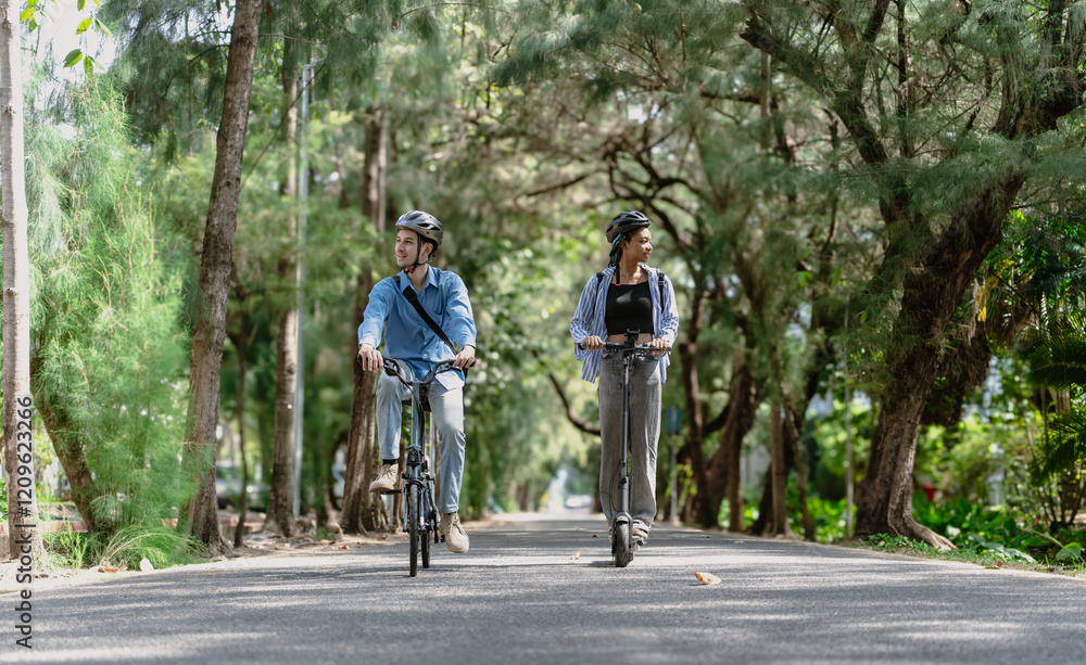 Commuting to work with bicycle. Young business person cycling and riding electric scooter to office in downtown district. Modern diversity people use eco transportation in city. Sustainable lifestyle. Commuting to work with bicycle. Young business person cycling and riding electric scooter to office in downtown district. Modern diversity people use eco transportation in city. Sustainable lifestyle.