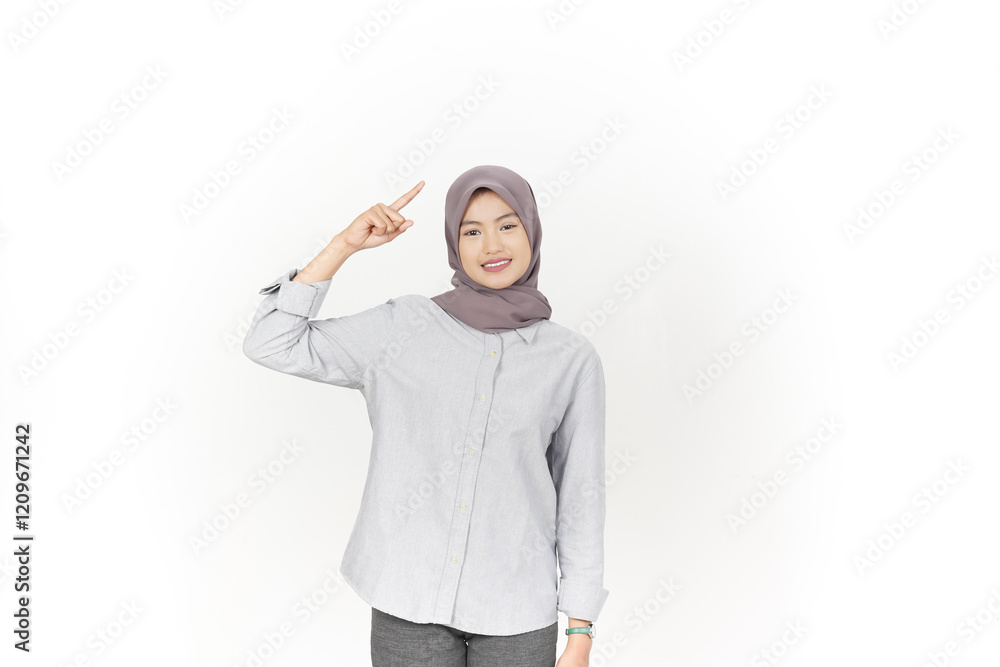 Showing, Presenting and pointing up at copyspace Of Beautiful Asian Woman Wearing Hijab Isolated On White Background Showing, Presenting and pointing up at copyspace Of Beautiful Asian Woman Wearing Hijab Isolated On White Background