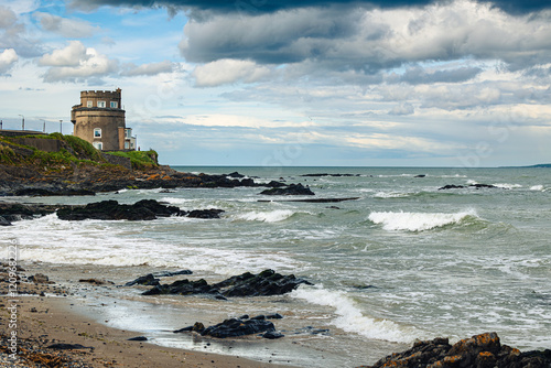View of Martello Tower on Portmarnock Beach, on a windy spring day,  Ireland