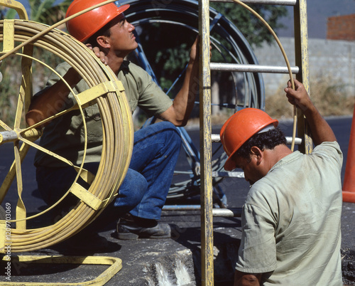 Fiber optic cable outdoors men worker photo