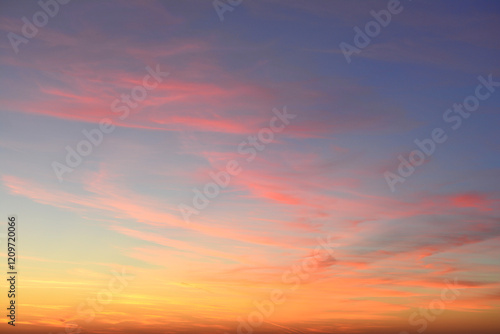 a background of the sunset sky with some clouds and light
