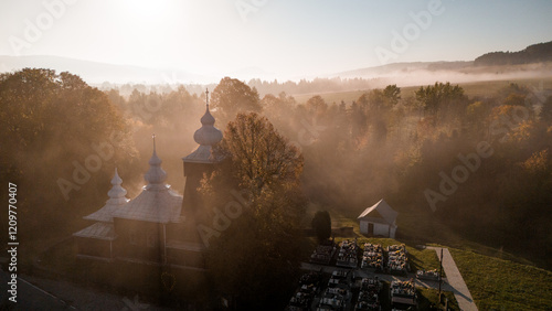 Fototapeta Naklejka Na Ścianę i Meble -  Scenic Drone Shot of Traditional Orthodox Church in Poland's Carpathian Range