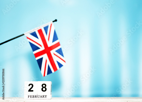 February calendar with British flag with number 28. Calendar cubes with numbers. Space copy. photo