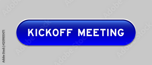Blue color capsule shape button with word kickoff meeting on gray background