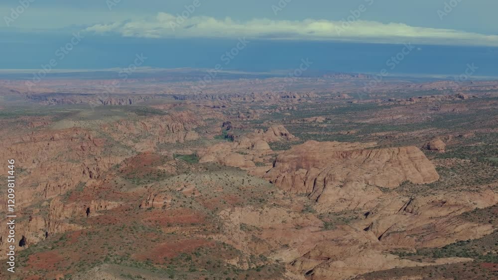 Moab’s red rock canyons and vast desert under a bright blue sky, aerial view Moab’s red rock canyons and vast desert under a bright blue sky, aerial view