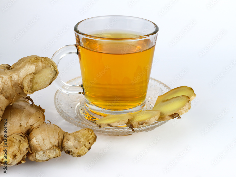 Hot ginger tea with sliced ginger - on white background Hot ginger tea with sliced ginger - on white background
