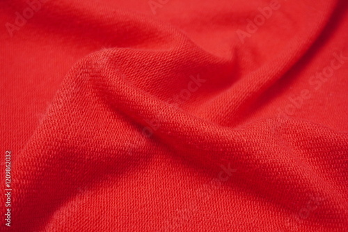 red fabric of sweater with ripples and waves texture background