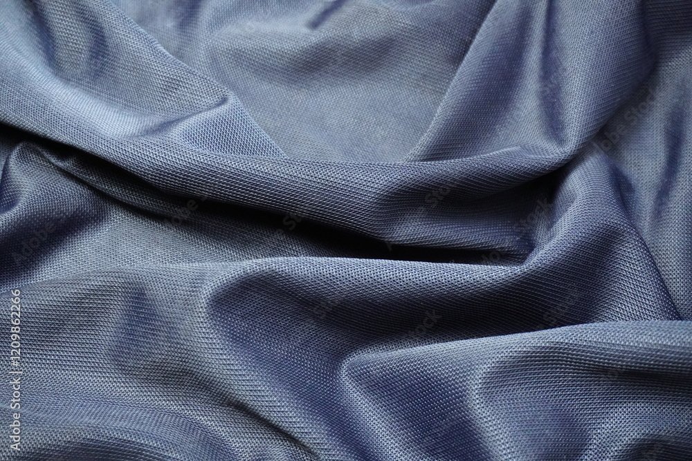 Obraz premium navy blue fabric with ripples and waves texture background