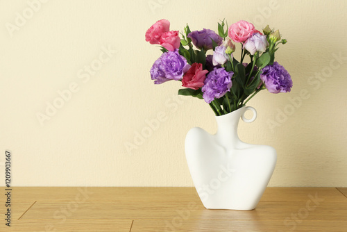 Wallpaper Mural Vase with beautiful eustoma flowers on wooden table, space for text Torontodigital.ca
