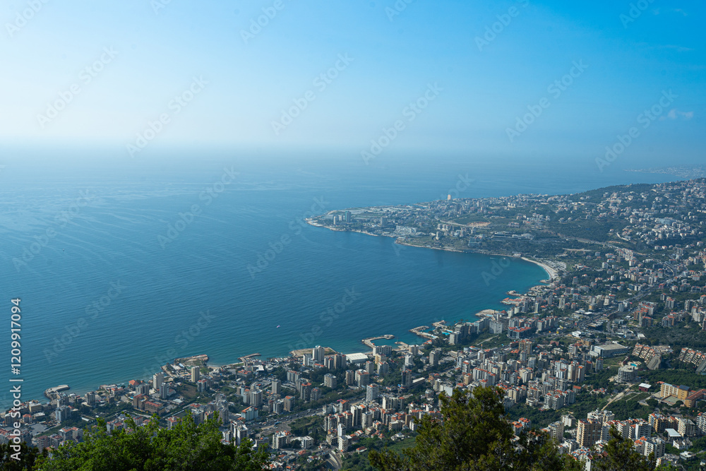 A serene view from the famous Marian statue, capturing Lebanon’s coastal beauty. Travel guides, religious tourism, and scenic photography. A serene view from the famous Marian statue, capturing Lebanon’s coastal beauty. Travel guides, religious tourism, and scenic photography.