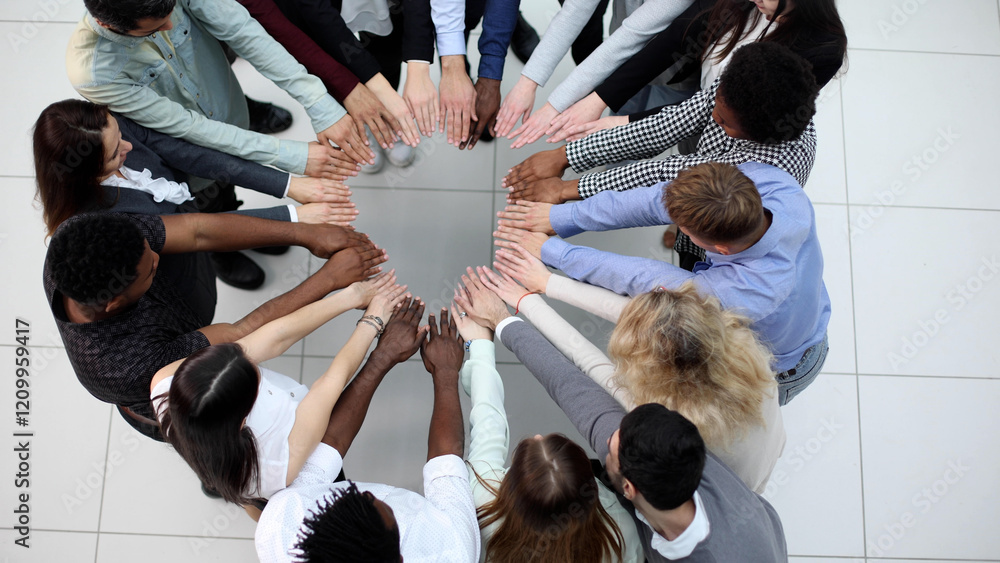 Obraz premium Business people stretched out their hands towards each other while standing in a modern office. view from ferhu