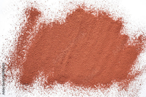 Abstract background photograph of hot chocolate cocoa powder on white. Close up. Top view. 