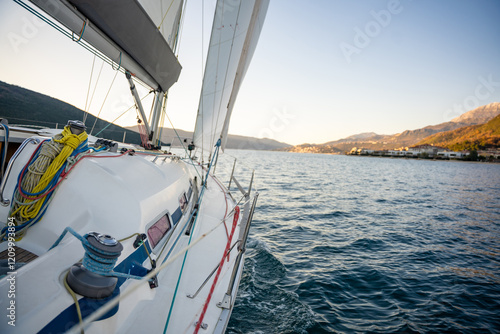 Yacht sailing in Adriatic sea. Close-up view of the deck, mast and sails. Yachting concept