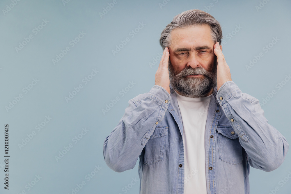 Fototapeta premium Senior man suffering from headache touching temples with hands
