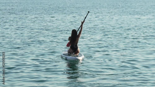 Woman Paddleboarding Water Recreation photo