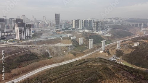 Aerial shot of bridges and buildings within a valley in Istanbul city