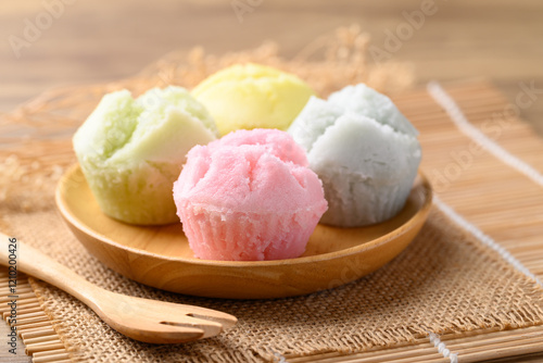 Thai Dessert, Steamed cupcake (Khanom Pui Fai) on wooden plate photo