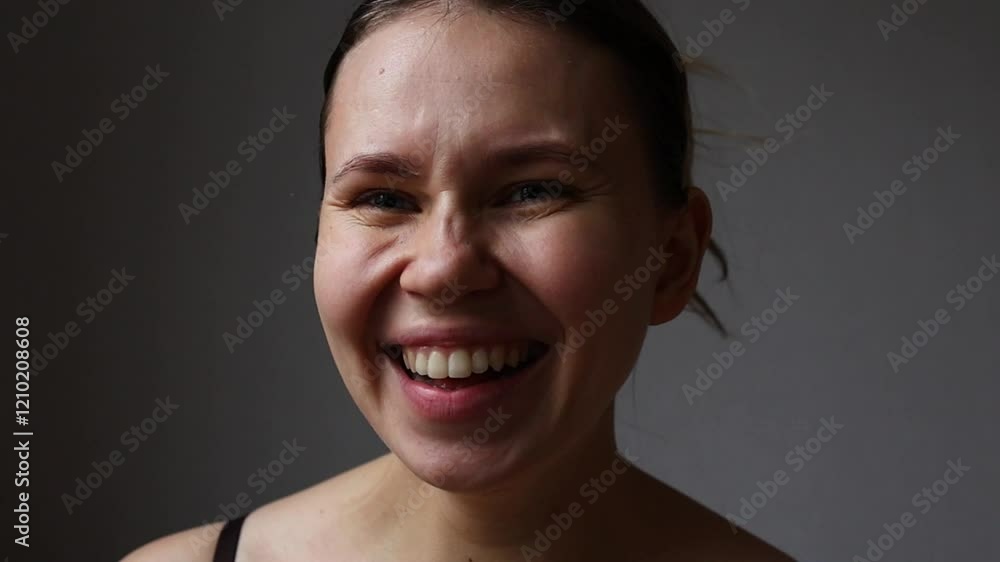 The girl covers her mouth in surprise. The girl covers her mouth in surprise.