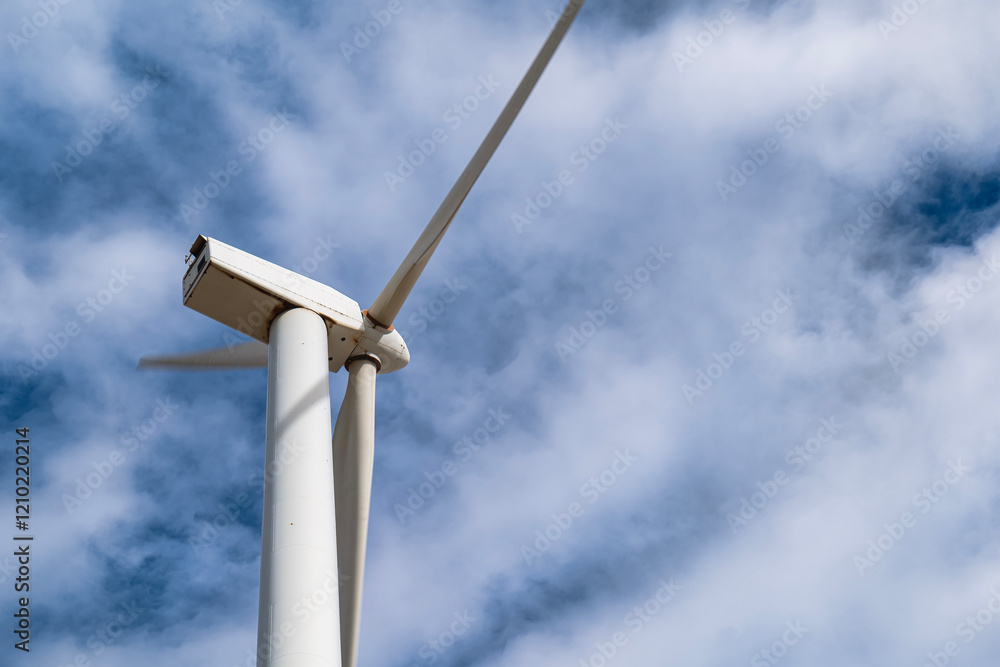 Sustainability. Close-up of Wind Turbine in a Cloudy Sky. Sustainability. Close-up of Wind Turbine in a Cloudy Sky.
