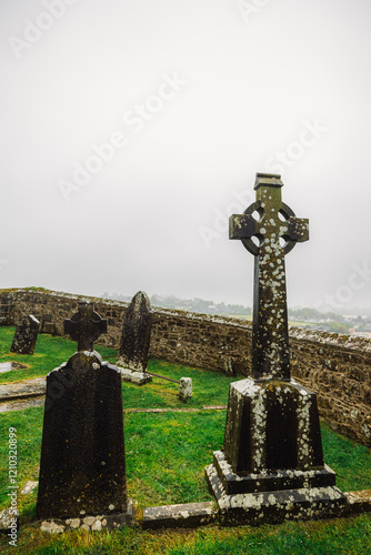 Celtic crosses at Rock of Cashel in Rainy foffy Irish Day , County Tipperary, Ireland