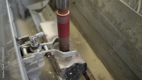 The machine drills core samples for study in the laboratory