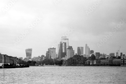 Grainy monochrome cityscape of london featuring the city of london skyline