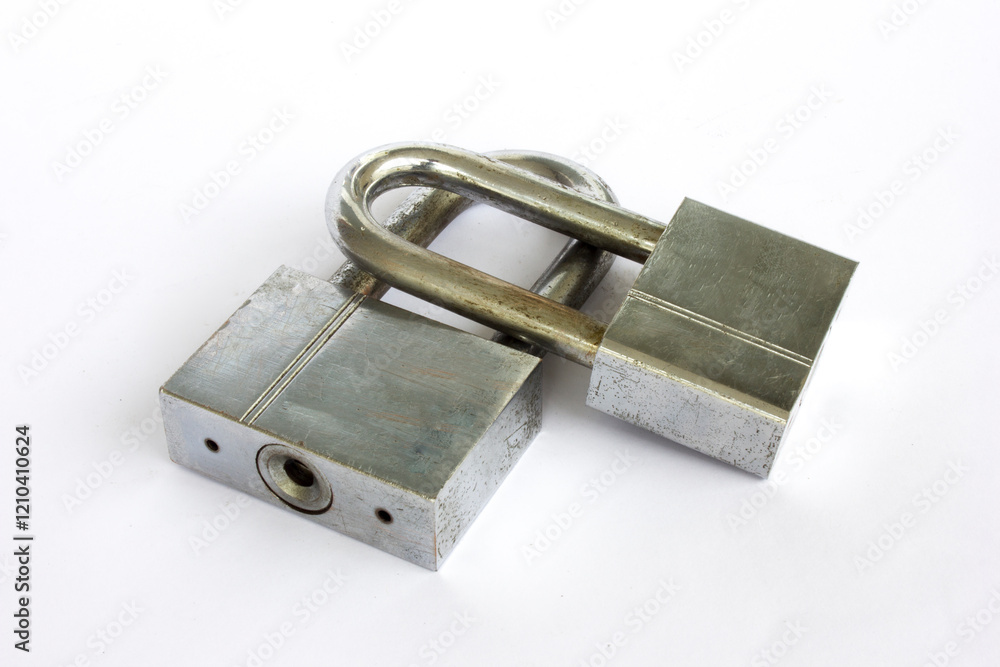 Two rusty and old locks isolated on a white background. Two rusty and old locks isolated on a white background.