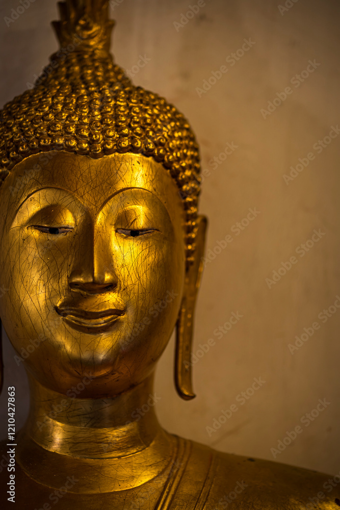 Close-up of Old Beautiful Golden Buddha statues at Wat Phra Si Rattana Mahathat also colloquially referred is a Buddhist temple It is a major tourist is Public places in Phitsanulok,Thailand.