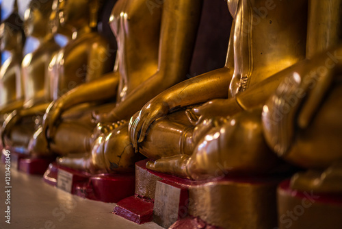 Obraz na płótnie Old Beautiful Golden Buddha Many statues at Wat Phra Si Rattana Mahathat also colloquially referred to as Wat Yai is a Buddhist temple It is a major tourist is Public places in Phitsanulok,Thailand. w salonie