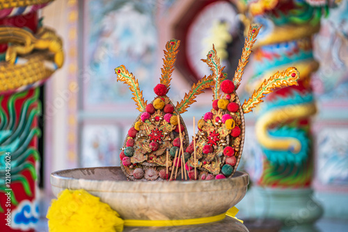 Obraz na płótnie Red candles and burning incense sticks Paper gold with the Chinese alphabet Blessings written on it Is a Fortune blessing compliment for pay respect to god in Chinese New Year day at a Chinese shrine w salonie