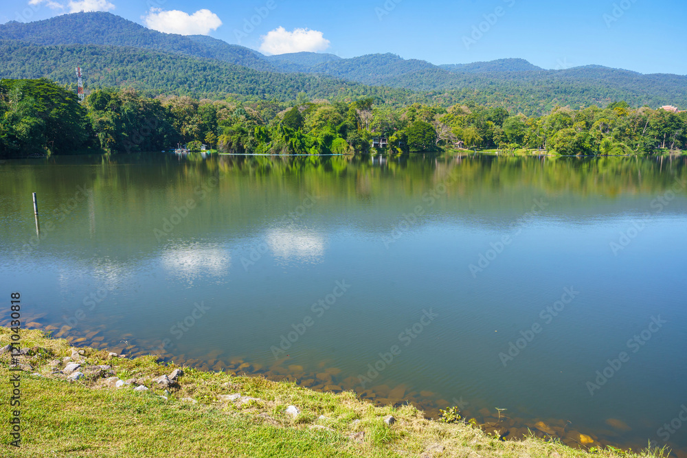 a public place leisure travel landscape lake views at Ang Kaew Chiang Mai University and Doi Suthep nature forest Mountain views spring cloudy sky background with white cloud.