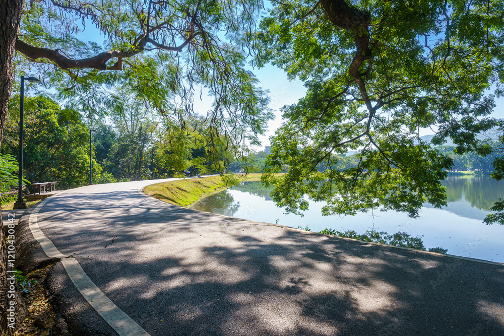 a public place leisure travel landscape lake views at Ang Kaew Chiang Mai University and Doi Suthep nature forest Mountain views spring cloudy sky background with white cloud.