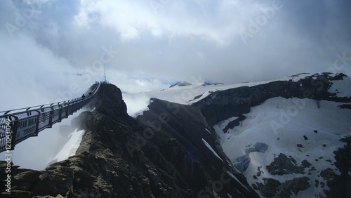 The Peak Walk by Tissot: The only suspension bridge in the world that links two mountain peaks photo