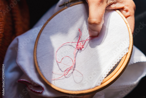 Vászonkép close up of woman hands embroidering using embroidery hoop and sewing kit on canvass
