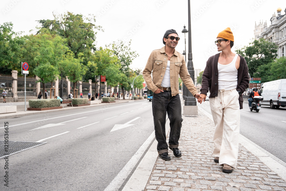 Colombian gay couple walking hand in hand in city street Colombian gay couple walking hand in hand in city street