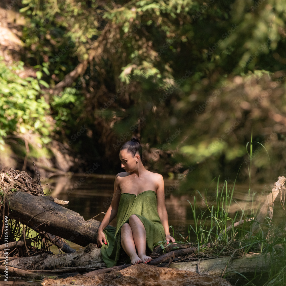 Beautiful young dark-haired girl in a forest river in summer. Beautiful young dark-haired girl in a forest river in summer.