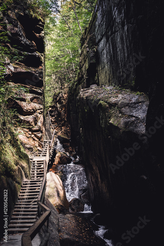 wooden walkway and path in the canyon of Flume Gorge in the Franconia Notch State Park, New Hampshire photo