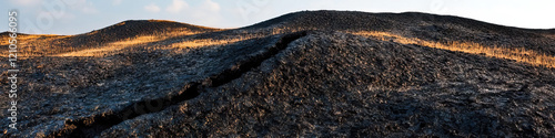 Dark Hills with Fissure and Dried Grass