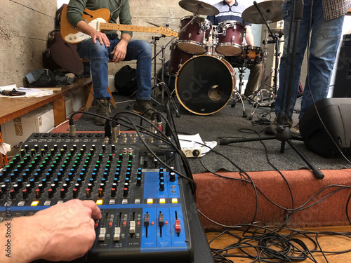 guy on soundboard while the band warms up