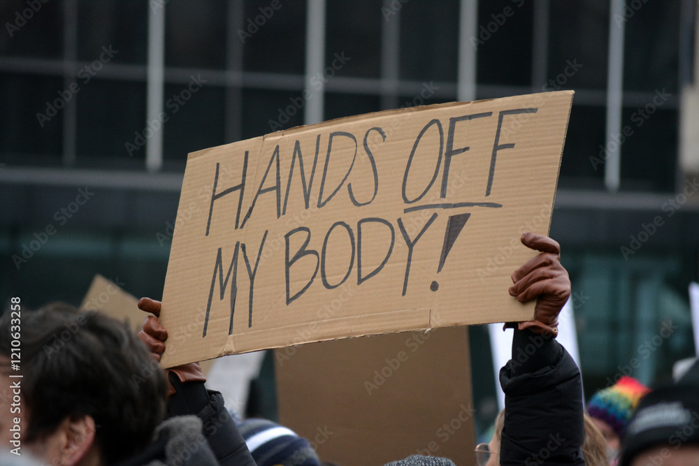 Person holding a sign at the 2025 People's March in New York City.