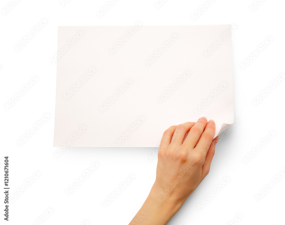 Woman's hand turning over paper Woman's hand turning over paper