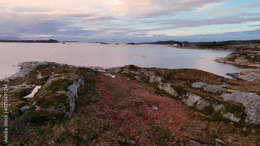 Aerial view from a drone flying over calm waters in Averoey, near Kristiansund, Norway Aerial view from a drone flying over calm waters in Averoey, near Kristiansund, Norway