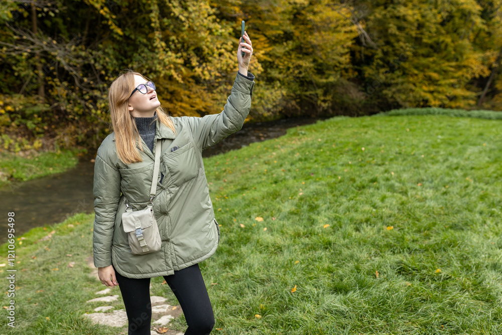 No communication coverage, lost contact signal device. Sad blonde woman got lost and could not find an internet connection on phone while hiking alone in the forest.