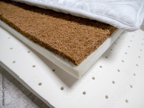 Different layers of mattress filler. Coconut coir, polyurethane foam, foam rubber, cotton mattress materials. Manufacture of furniture, mattress materials