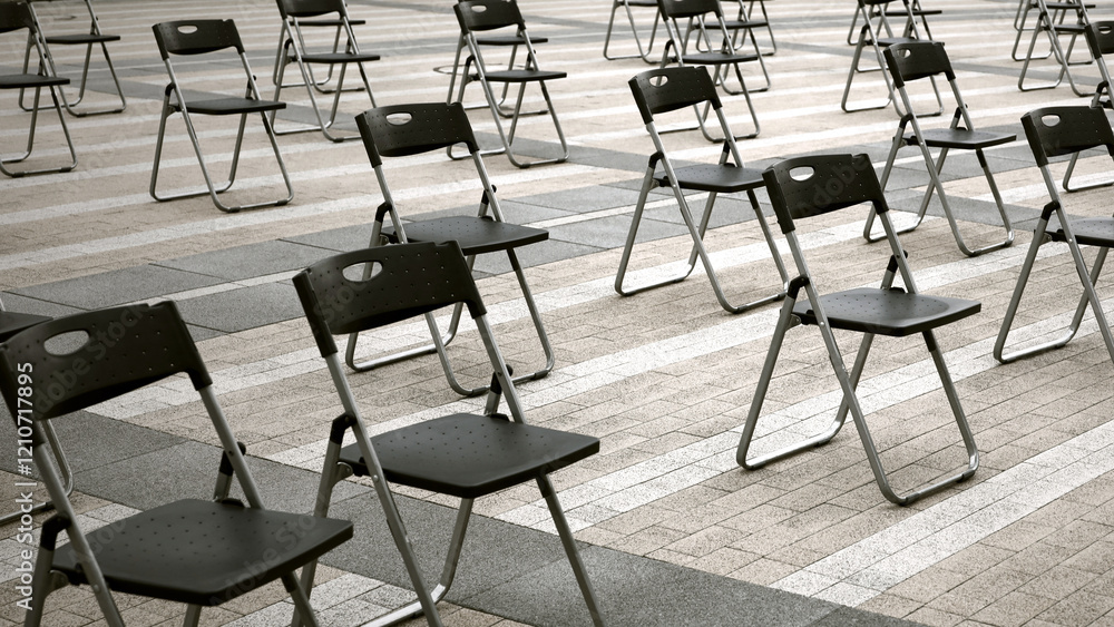 Folding chairs lined up at the event venue in the square Folding chairs lined up at the event venue in the square