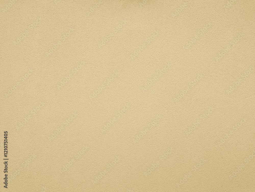 Ivory beige yellow paint wall texture or background with grainy, textured, gotele, scratched, rough and scratchy effect for typical Mediterranean house, chalet and villa exteriors in Spain. Ivory beige yellow paint wall texture or background with grainy, textured, gotele, scratched, rough and scratchy effect for typical Mediterranean house, chalet and villa exteriors in Spain.