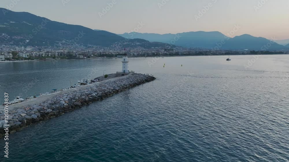 Sunrise over Lighthouse and Marina from a drone, Alanya, Turkish Riviera on Mediterranean Coast, Antalya, Turkey Sunrise over Lighthouse and Marina from a drone, Alanya, Turkish Riviera on Mediterranean Coast, Antalya, Turkey