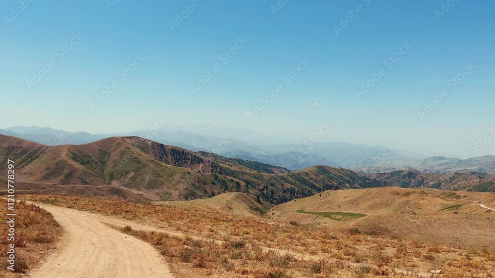 The mountain system of the Western Tien Shan in Uzbekistan. Panorama of the Western Tien Shan on the Angren plateau, Tashkent region. Promising orange mountains in the Western Tien Shan. 4K The mountain system of the Western Tien Shan in Uzbekistan. Panorama of the Western Tien Shan on the Angren plateau, Tashkent region. Promising orange mountains in the Western Tien Shan. 4K